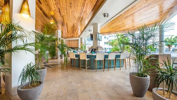 3 bars/lounges, 2 poolside bars, swim-up bar