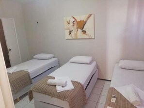 Standard Triple Room | Minibar, blackout curtains, iron/ironing board, free WiFi