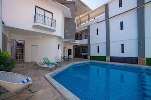 Outdoor pool, open 9 AM to 10:00 PM, pool umbrellas, sun loungers