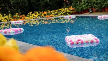 Outdoor pool, open 7:00 AM to 7:00 PM, pool umbrellas