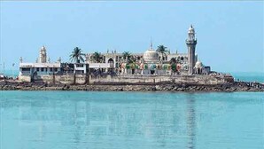 A coastal building with a lighthouse, a dome, and a series of arches. - Hotel Aksa (Mumbai)