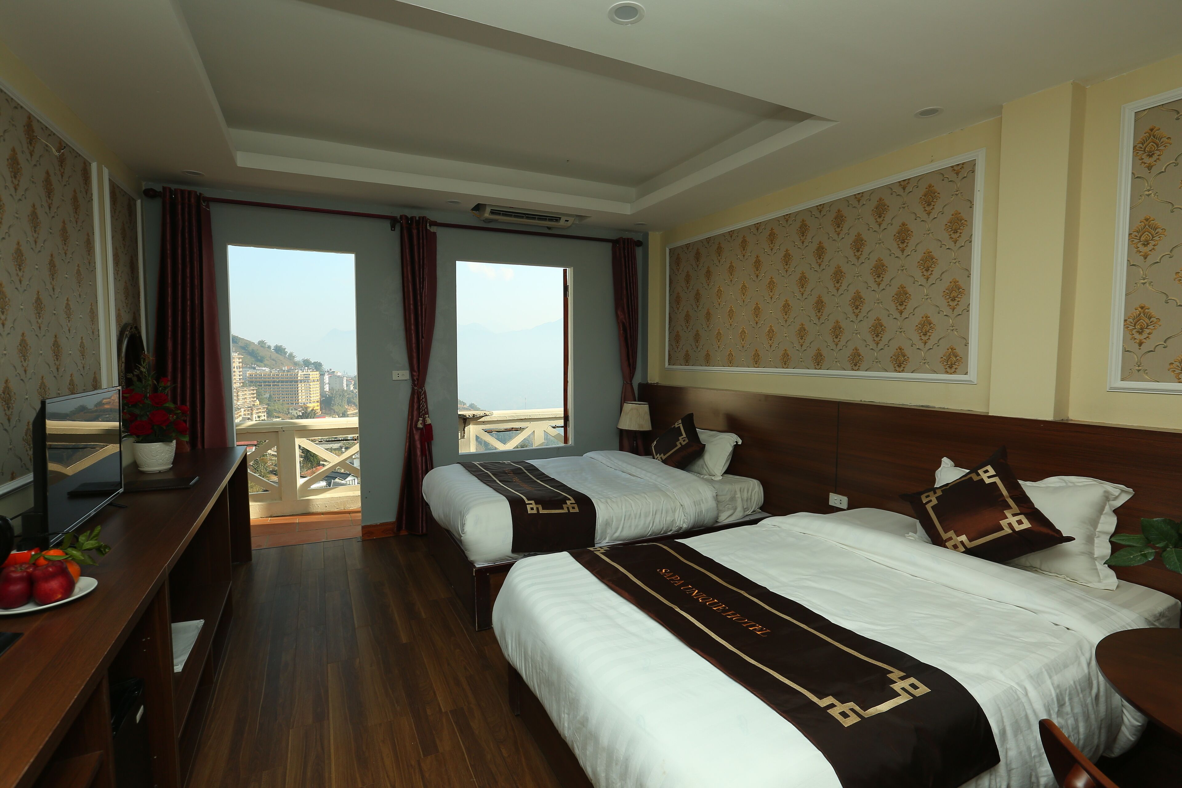 deluxe family room | minibar, in-room safe, desk, blackout curtains