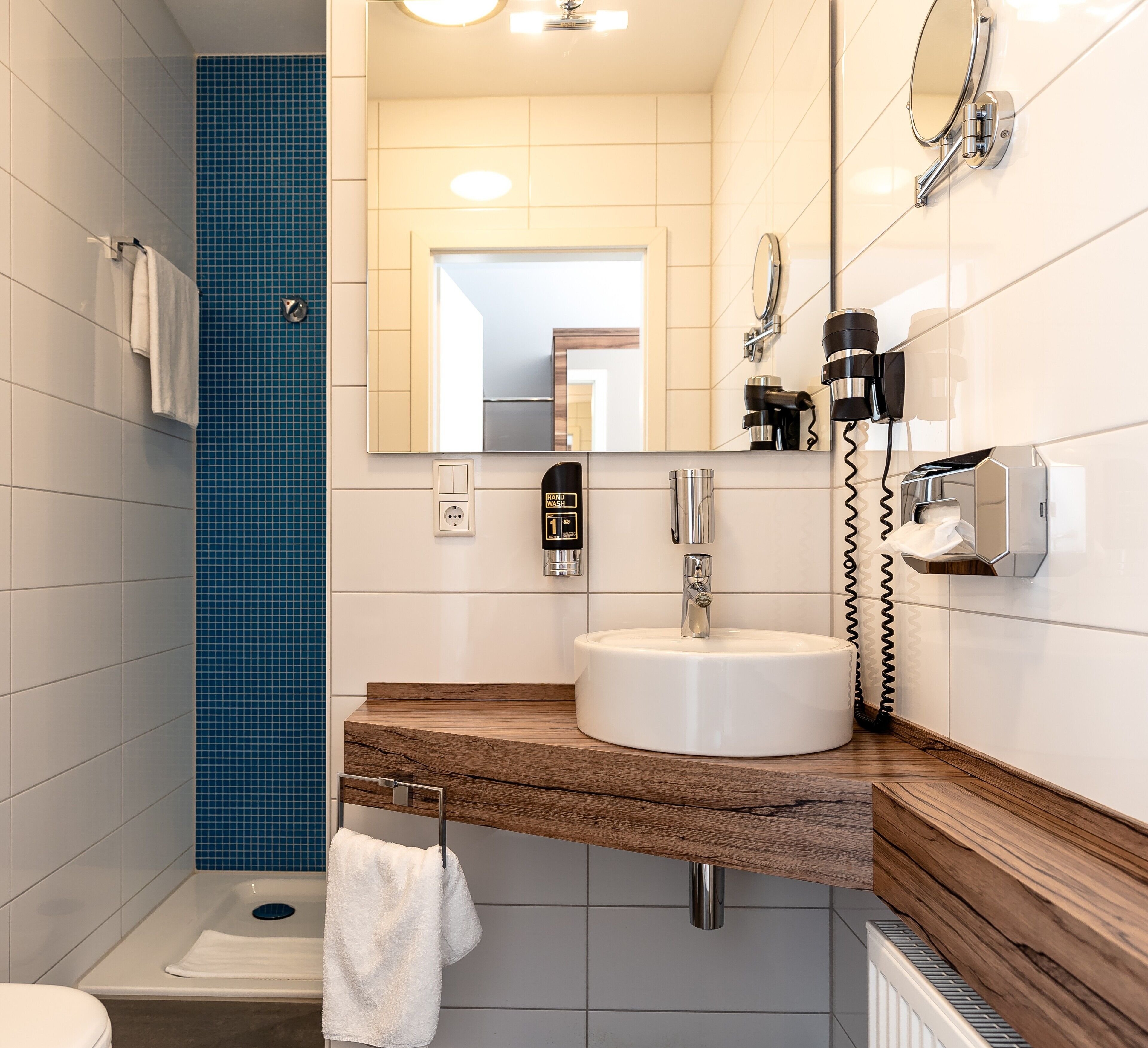 shower, eco-friendly toiletries, hair dryer, towels