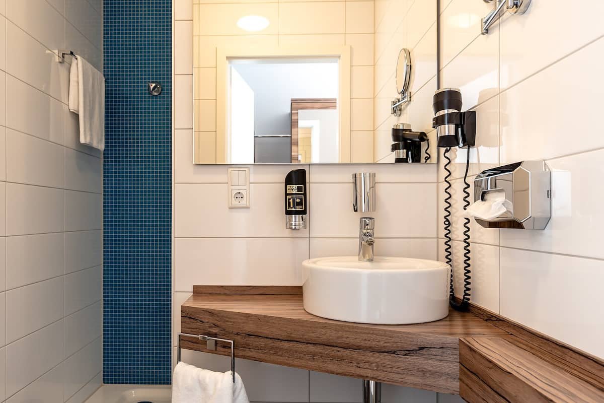 shower, eco-friendly toiletries, hair dryer, towels
