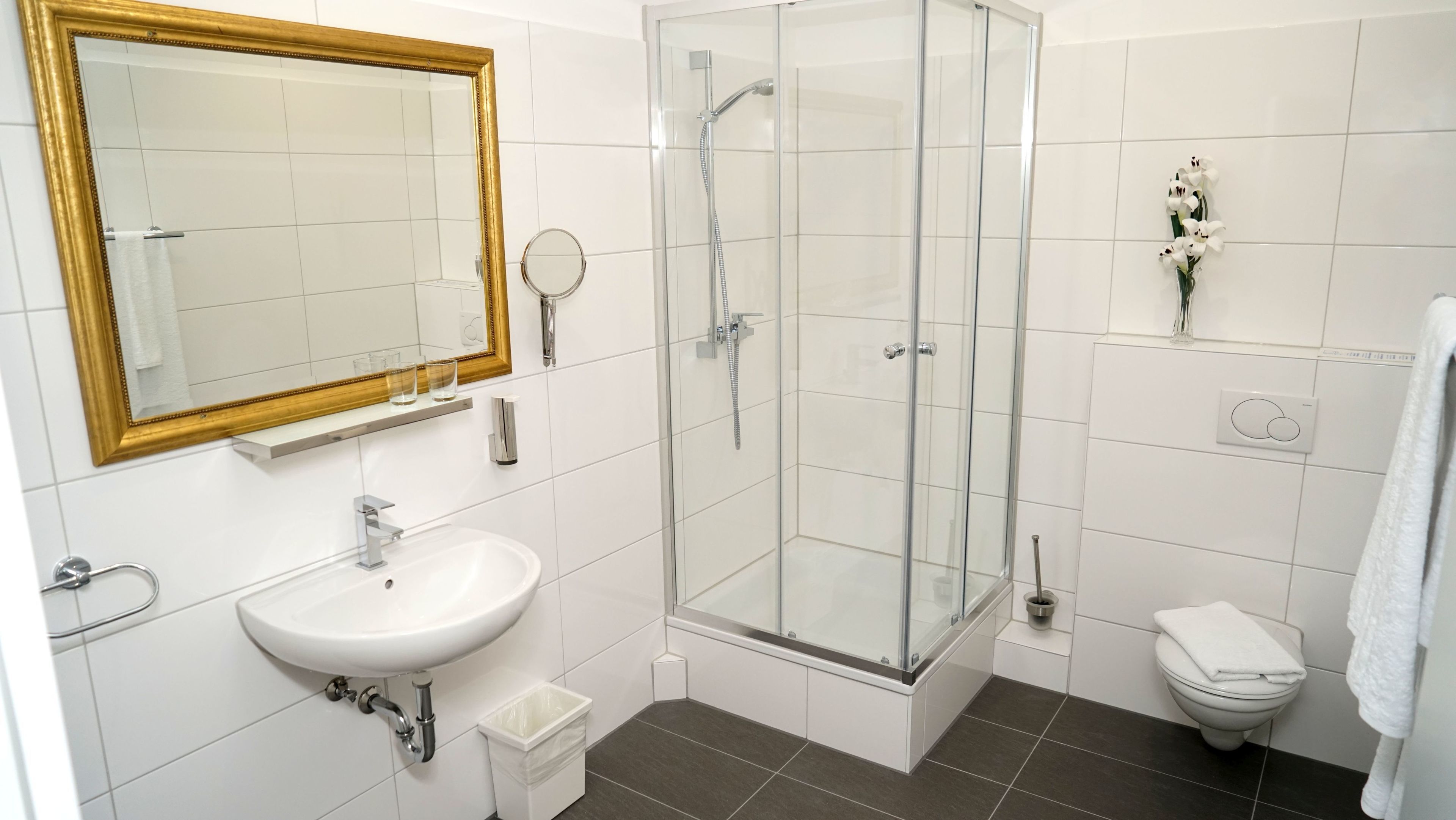 suite | bathroom | shower, hair dryer, slippers, towels