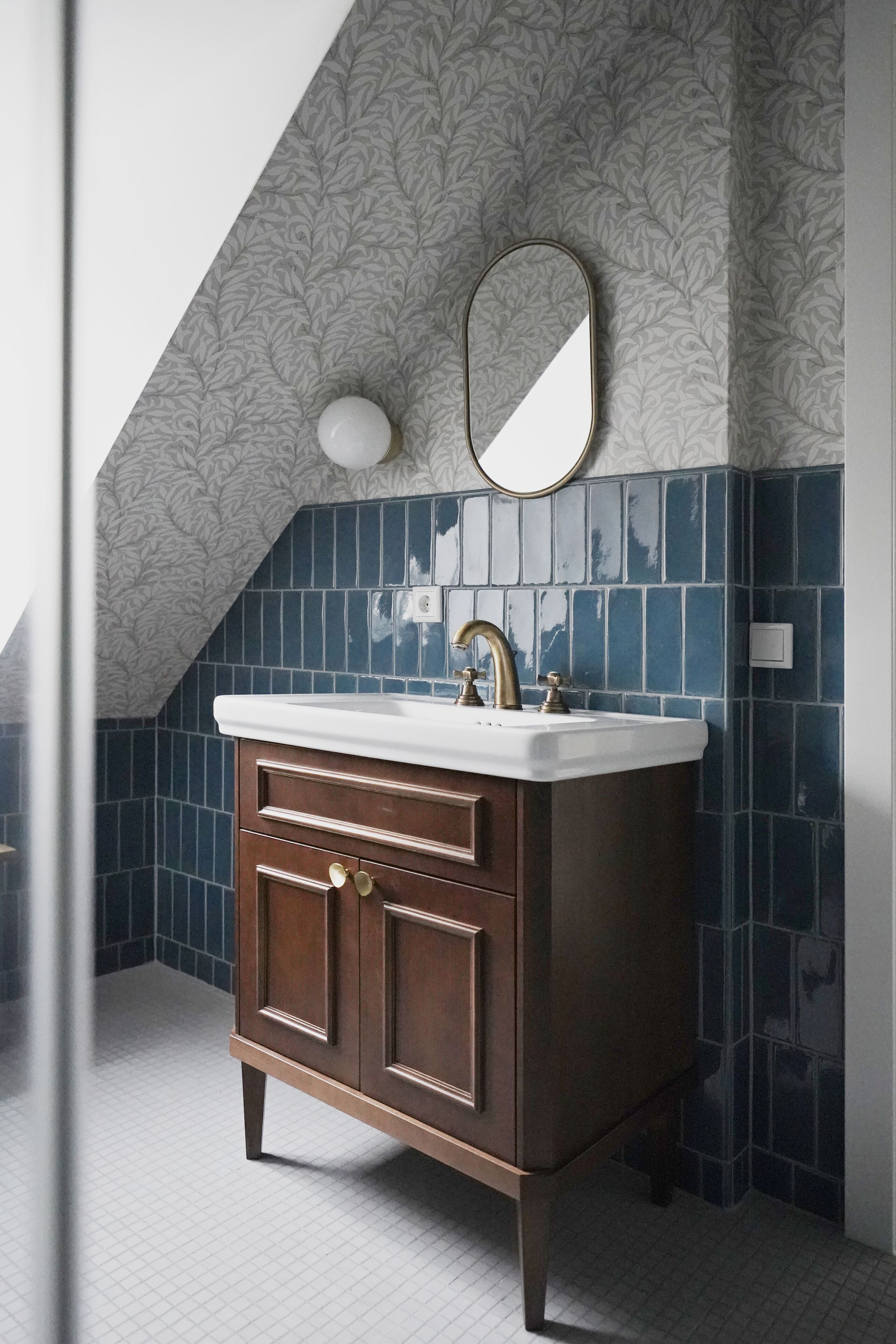 A bathroom with a vanity, a sink, and a mirror.