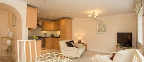 Executive Apartment, 2 Bedrooms (City Center / Home-for-Home) | Living area | Flat-screen TV, DVD player, pay movies