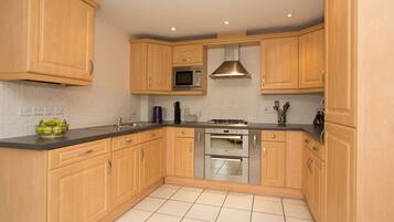 Executive Apartment, 2 Bedrooms (City Center / Home-for-Home) | Private kitchen | Fridge, microwave, oven, dishwasher