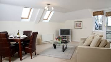 Executive Apartment, 2 Bedrooms (City Center / Home-for-Home) | Living room | Flat-screen TV, DVD player, pay movies
