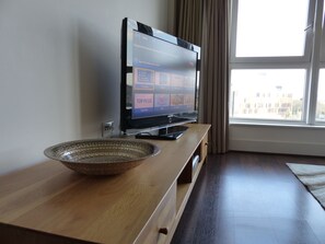 Luxury Apartment, 2 Bedrooms, Accessible, City View (Downtown) | Living area | Flat-screen TV, DVD player, pay movies
