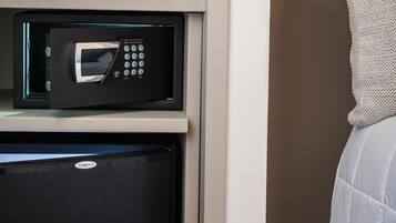 A microwave and a refrigerator in a kitchen area.