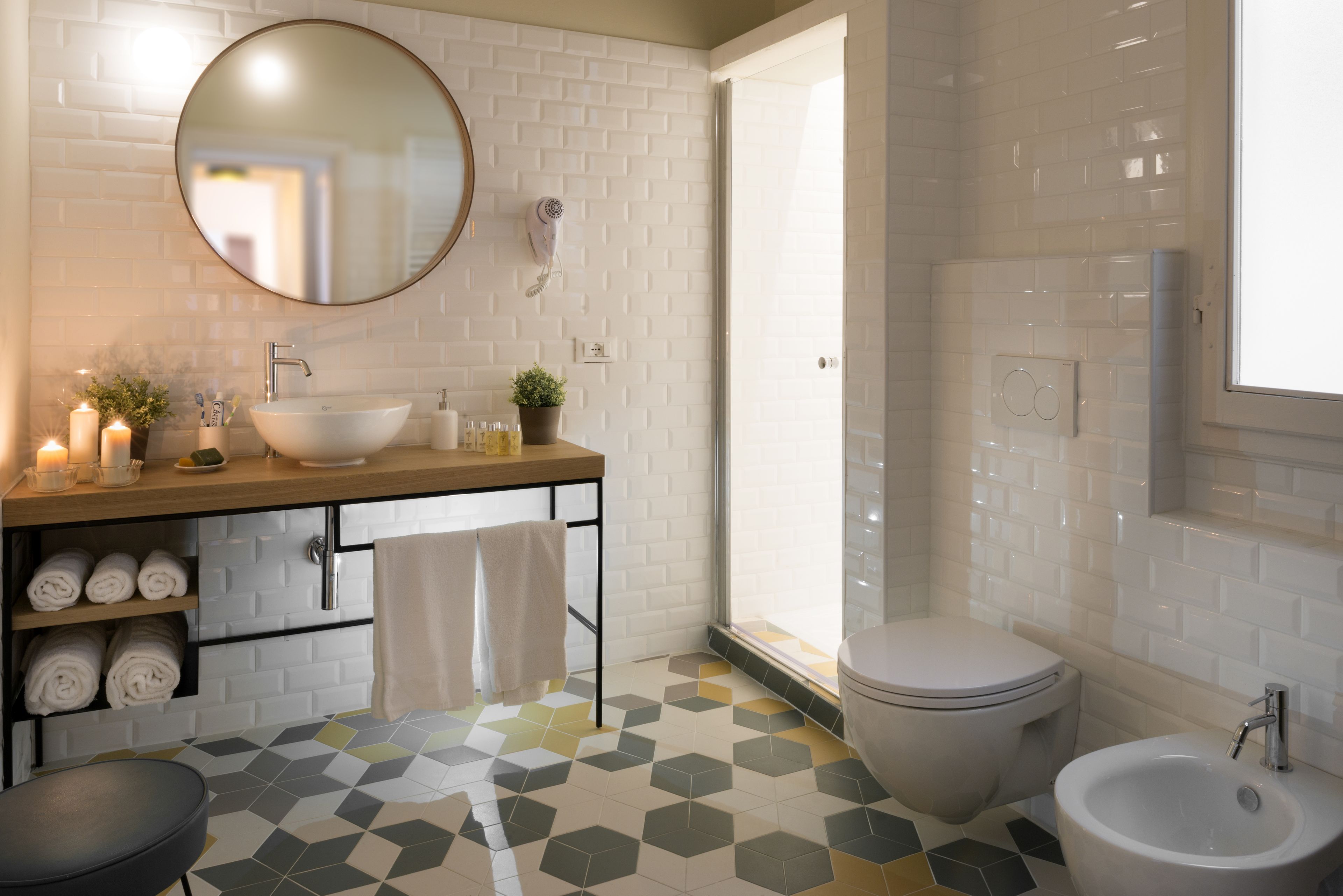 junior suite | bathroom | shower, rainfall showerhead, bidet, towels