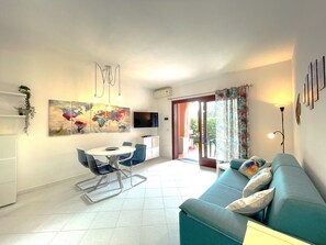 Apartment, 1 Bedroom | Living area | Flat-screen TV, toys - Vecchio Ulivo (San Teodoro)