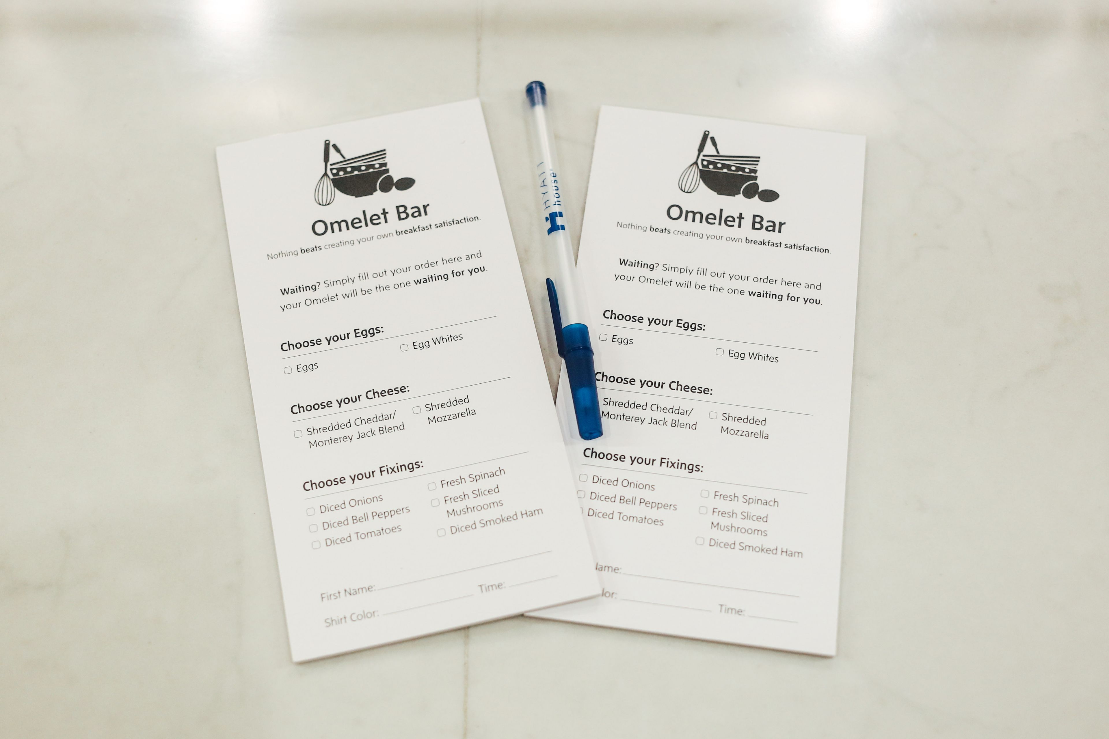 Two Omelet Bar menus with options for eggs, cheese, and fixings.
