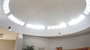 A room with a high, curved ceiling featuring skylights. - Costa del Mar 57 2 Bedroom Apartment By Seaside San Carlos (San Carlos)
