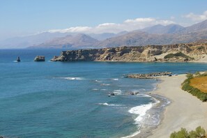 A coastal landscape with a beach, rocky cliffs, and a clear sky. - Villa in Agia Galini with Pool Views (Agia Galini)