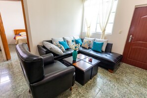Family Apartment, 2 Bedrooms, Kitchen, Ground Floor | Living area | 32-inch LCD TV with cable channels, TV - Ariana´S Galapagos Hostal (Puerto Ayora)