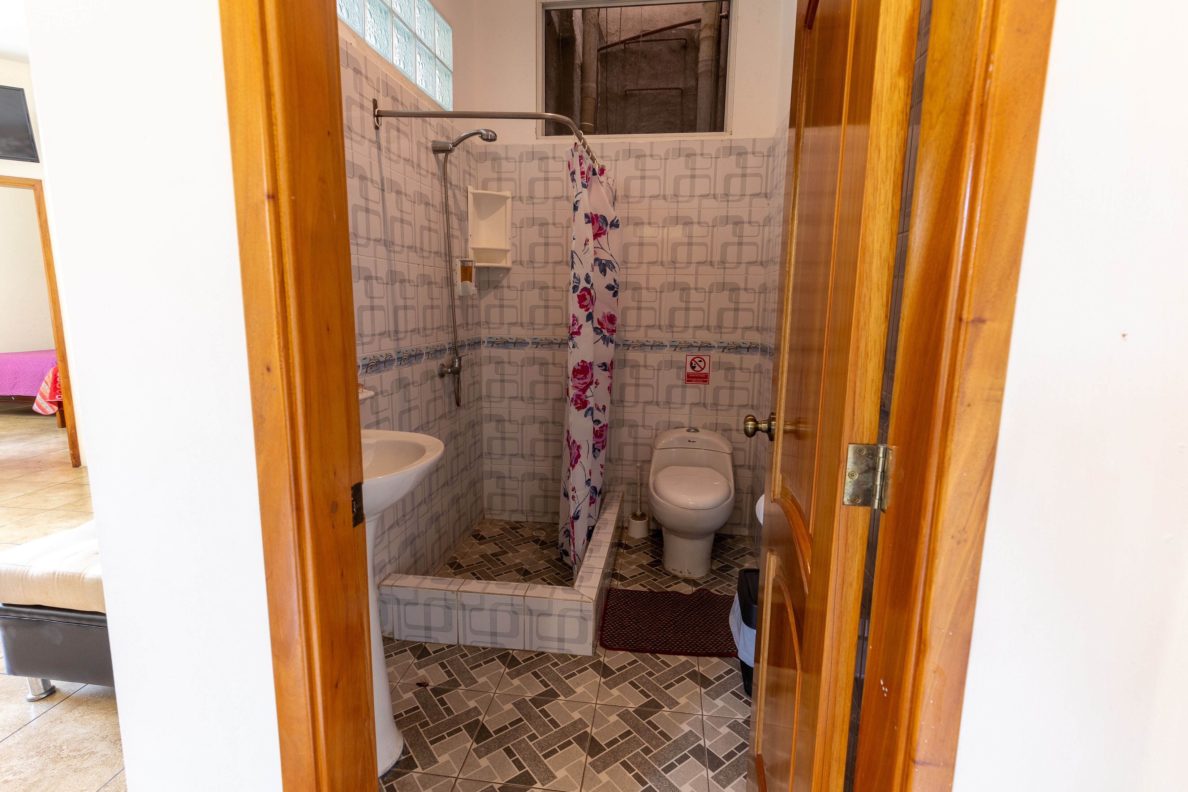 Shower, rainfall showerhead, designer toiletries, hair dryer