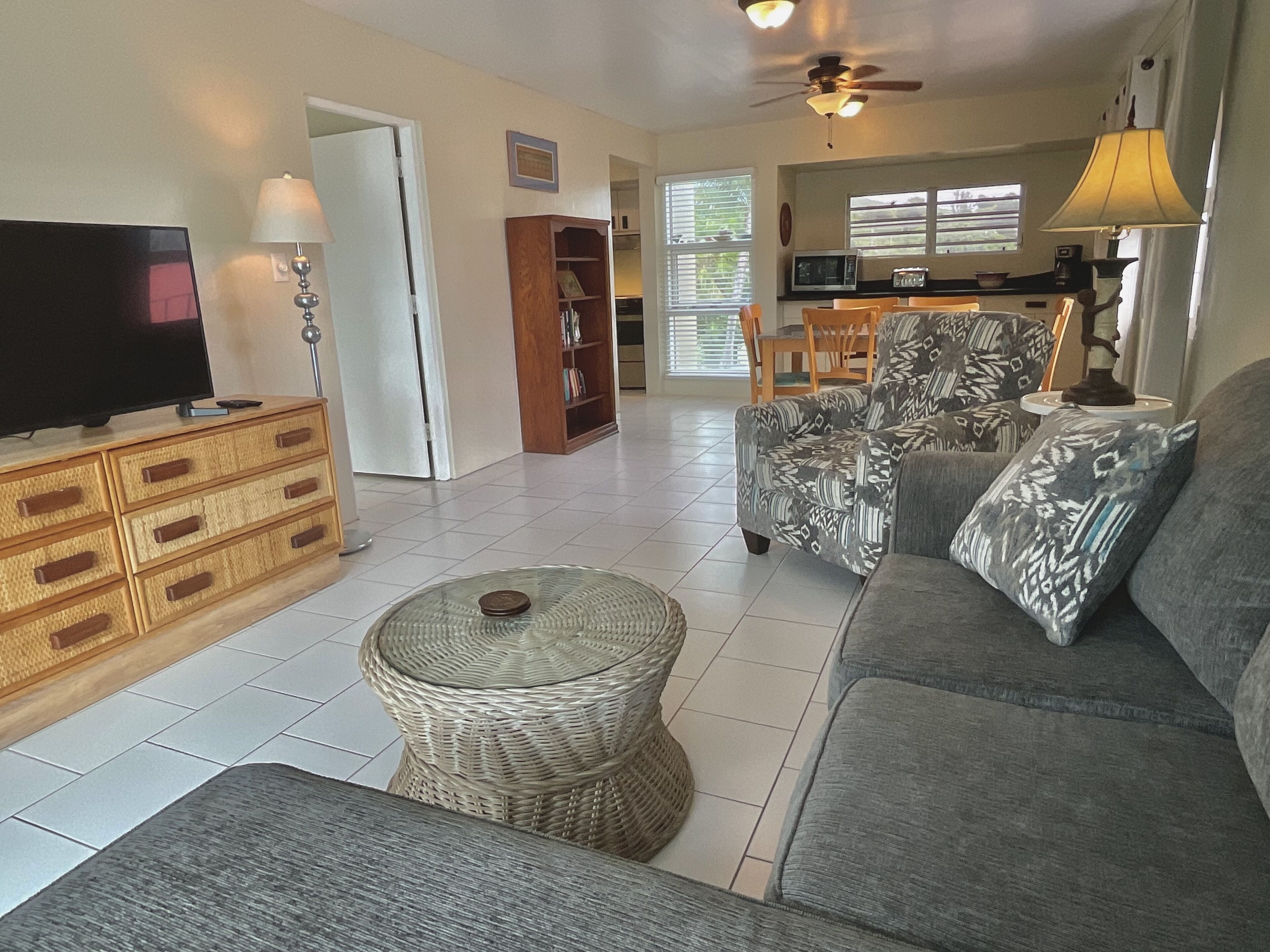 waterfront king suite with balcony | living area | 43-inch smart tv with digital channels, tv, streaming services