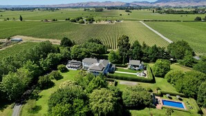 A large estate with expansive vineyards, a swimming pool, and a well-maintained garden. - The Marlborough (Rapaura)