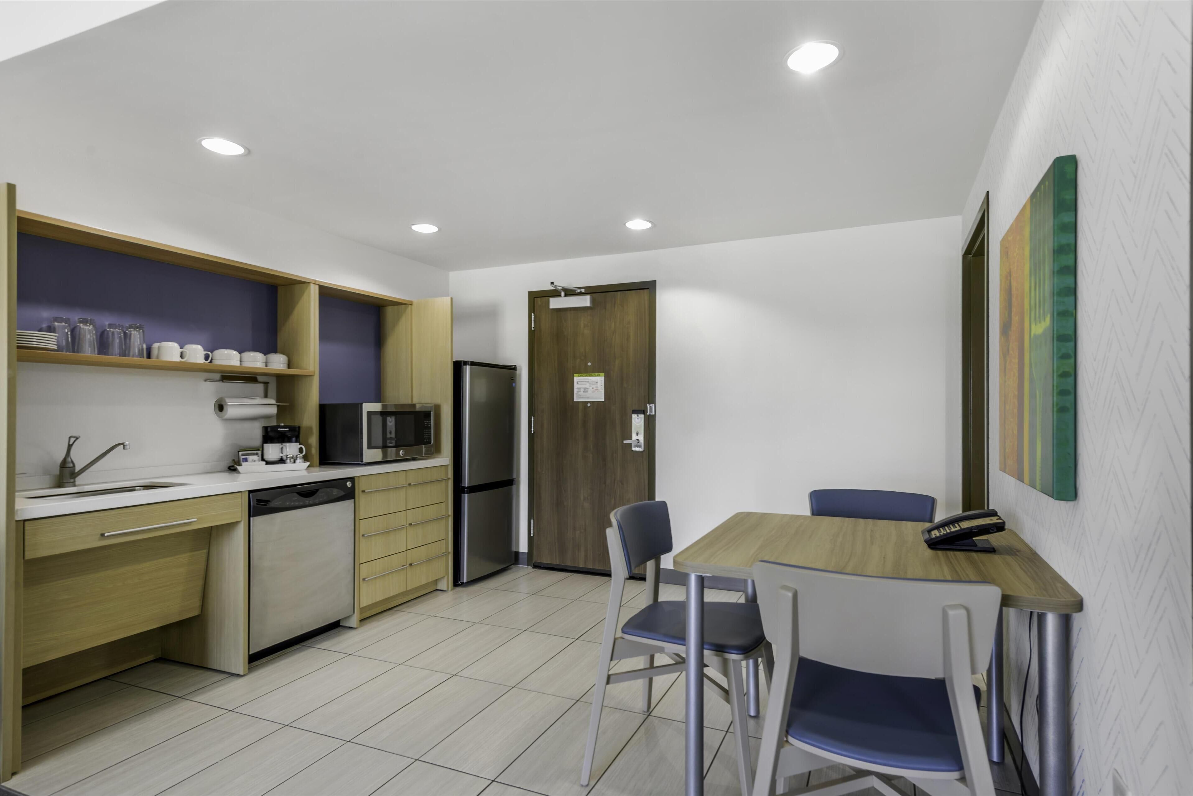 suite, 1 king bed, accessible, non smoking (mob/hearing acc w/ bathtub) | private kitchen | full-sized fridge, microwave, dishwasher, coffee/tea maker