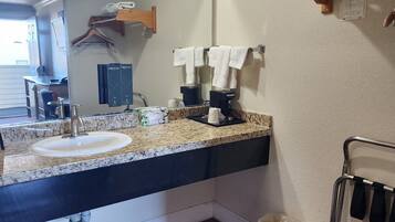 Combined shower/tub, deep soaking tub, designer toiletries, hair dryer