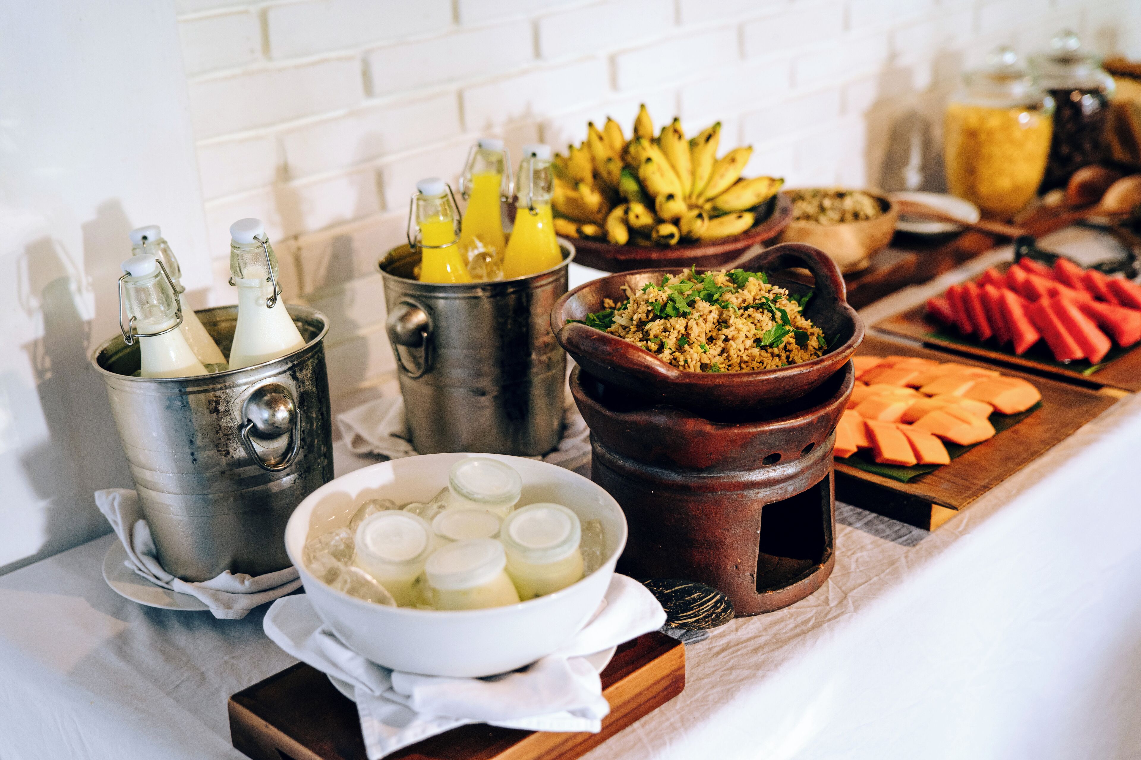 A breakfast buffet with various food items and beverages.