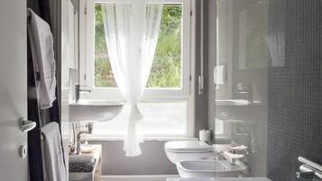 Shower, free toiletries, hair dryer, bathrobes
