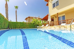 Outdoor pool, pool umbrellas, pool loungers