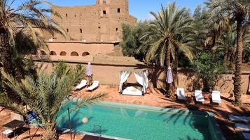 Outdoor pool, pool umbrellas, sun loungers