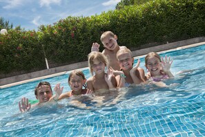 Outdoor pool, a heated pool, sun loungers