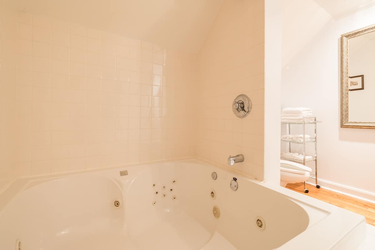 room, 2 queen beds (sir frederic carter executive suite) | bathroom | shower, free toiletries, hair dryer, towels