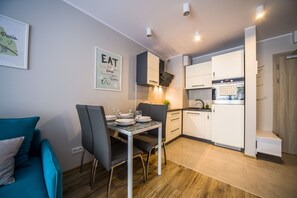 Apartment, 1 Bedroom, Balcony | Living area | Flat-screen TV - FriendHouse Apartments – Krowoderska (Kraków)