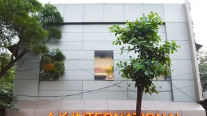 A building with a sign reading "A.K. INTERNATIONAL" and large windows. - Hotel AK International (Mumbai)