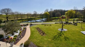 A well-maintained park with a pond, walking paths, and manicured lawns. - Peaceful Garden Retreat, Epiniac (Epiniac)