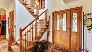 A staircase with wooden railings and carpeted steps leading to a second floor. - Highland Green 91 Town House (Breckenridge)