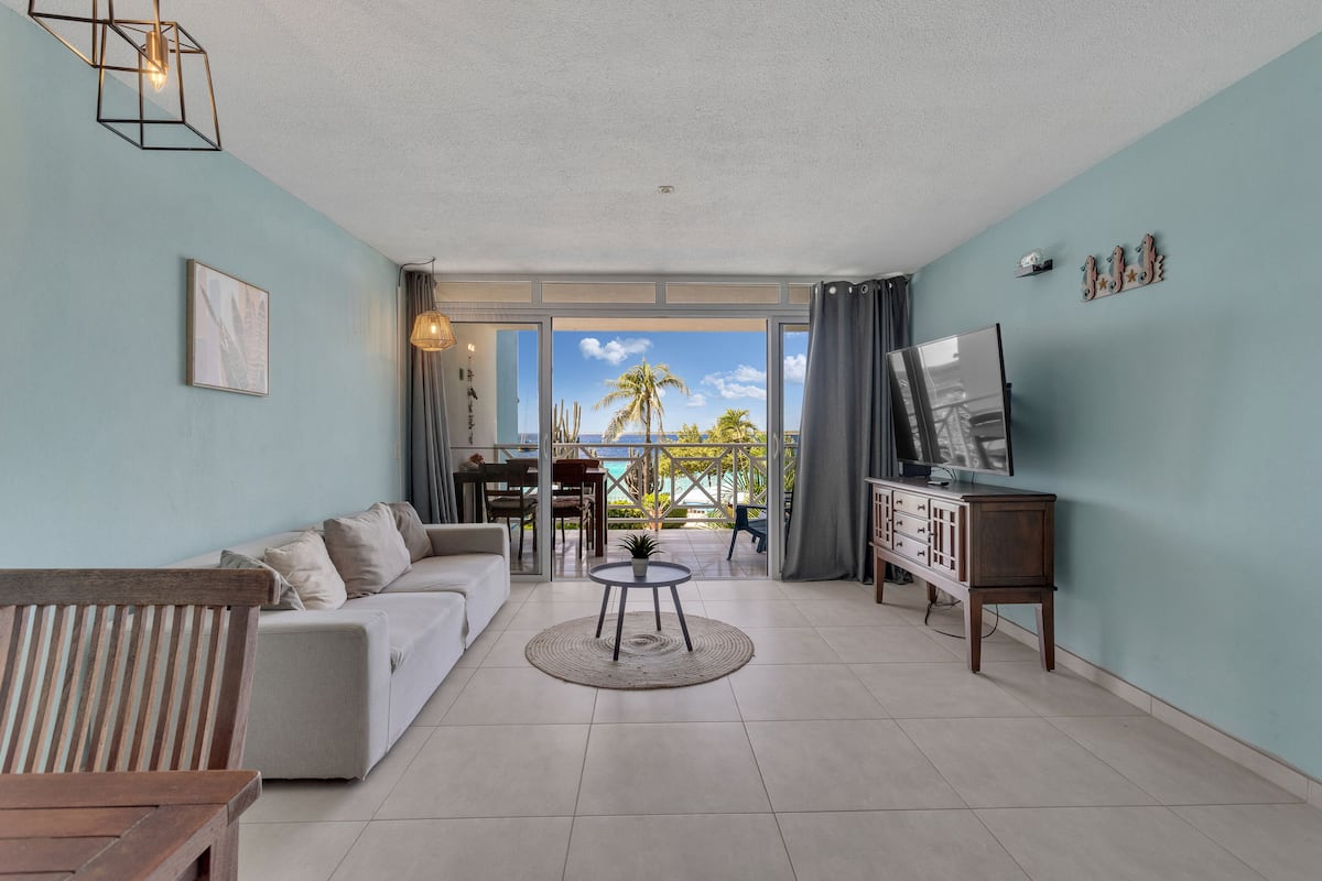 Panoramic Apartment, 1 King Bed, Sea View | Living area | Flat-screen TV