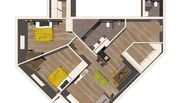 A floor plan of a hotel room with a bed, a desk, a chair, a small table, and a bathroom.