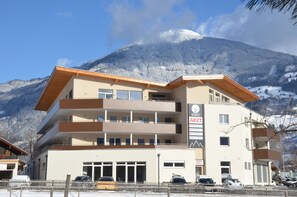 A multi-story building with a flat roof and a sign indicating it is a medical facility.