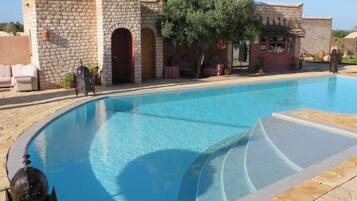 Outdoor pool, pool umbrellas, sun loungers