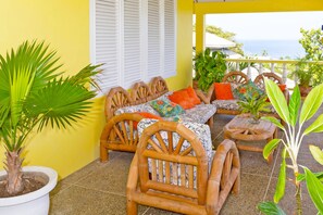 Warm Breezes - 3 bedrooms- shared pool-on a hill with lots of stairs, for the best Seaview. | Teras/patio