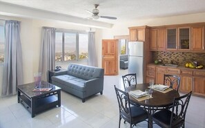 Deluxe Apartment, City View | Living area | Flat-screen TV - Residences Talou (Petionville)