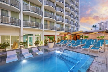 Outdoor pool, open 6:00 AM to 9:00 PM, sun loungers at The Laylow Waikiki, Autograph Collection