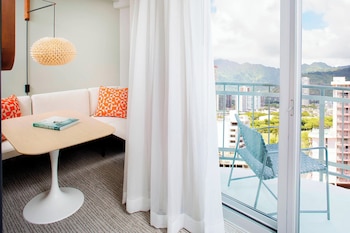 Hotel amenities such as safe, desk and work area at The Laylow Waikiki, Autograph Collection