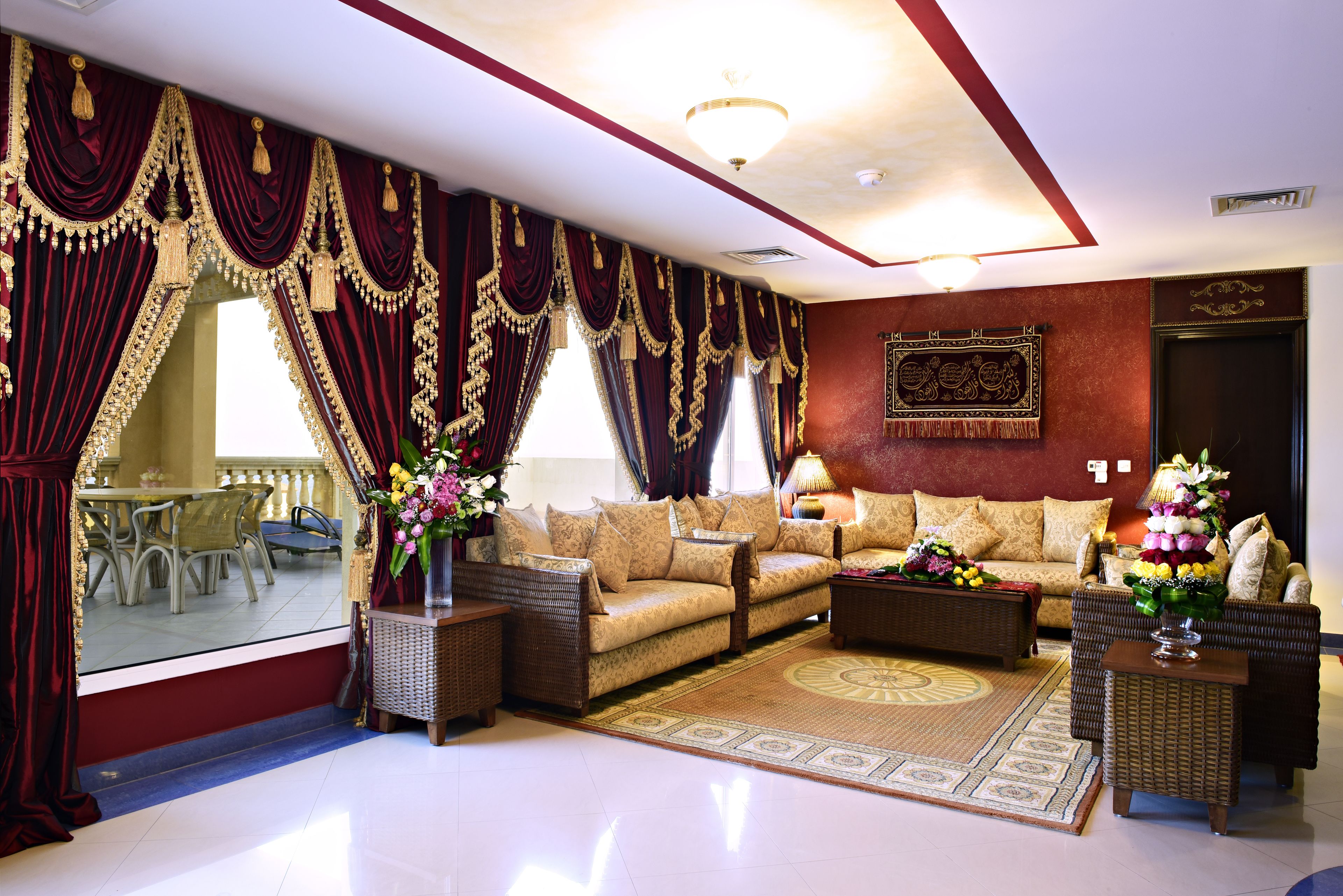 A spacious living room with a sofa set, a coffee table, and a decorative rug.