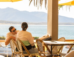 Enjoy a romantic dinner with a view of the surrounding mountains and water.