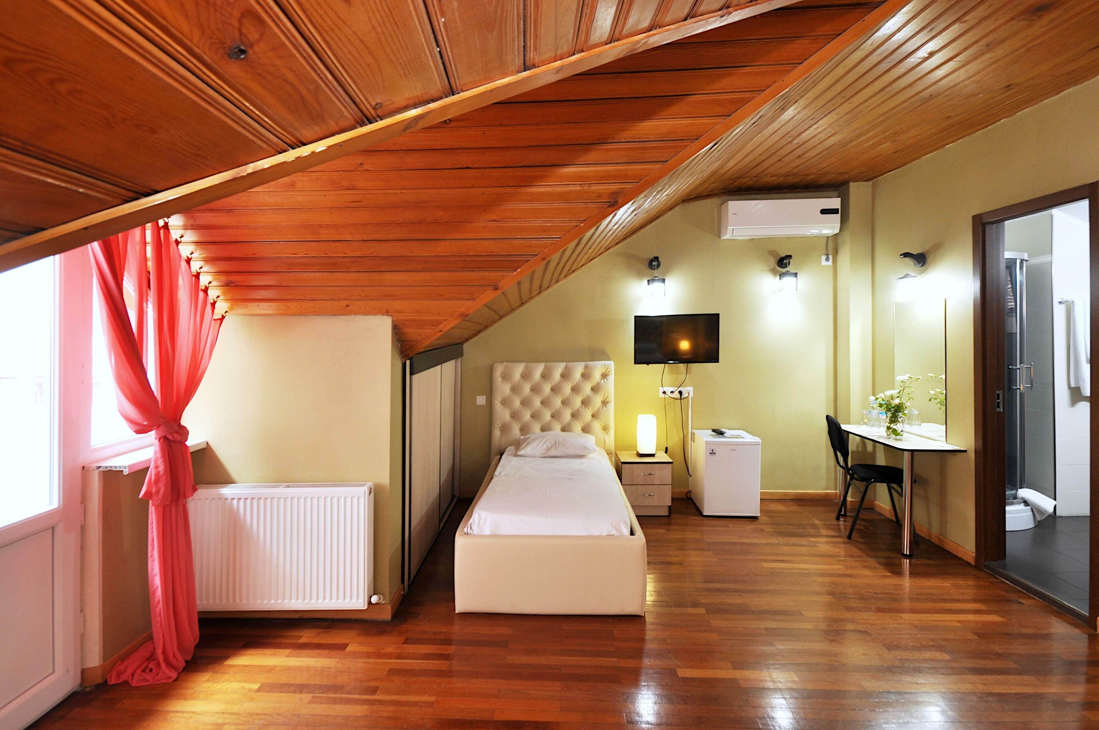 family triple room (attic) | 1 bedroom, minibar, desk, laptop workspace