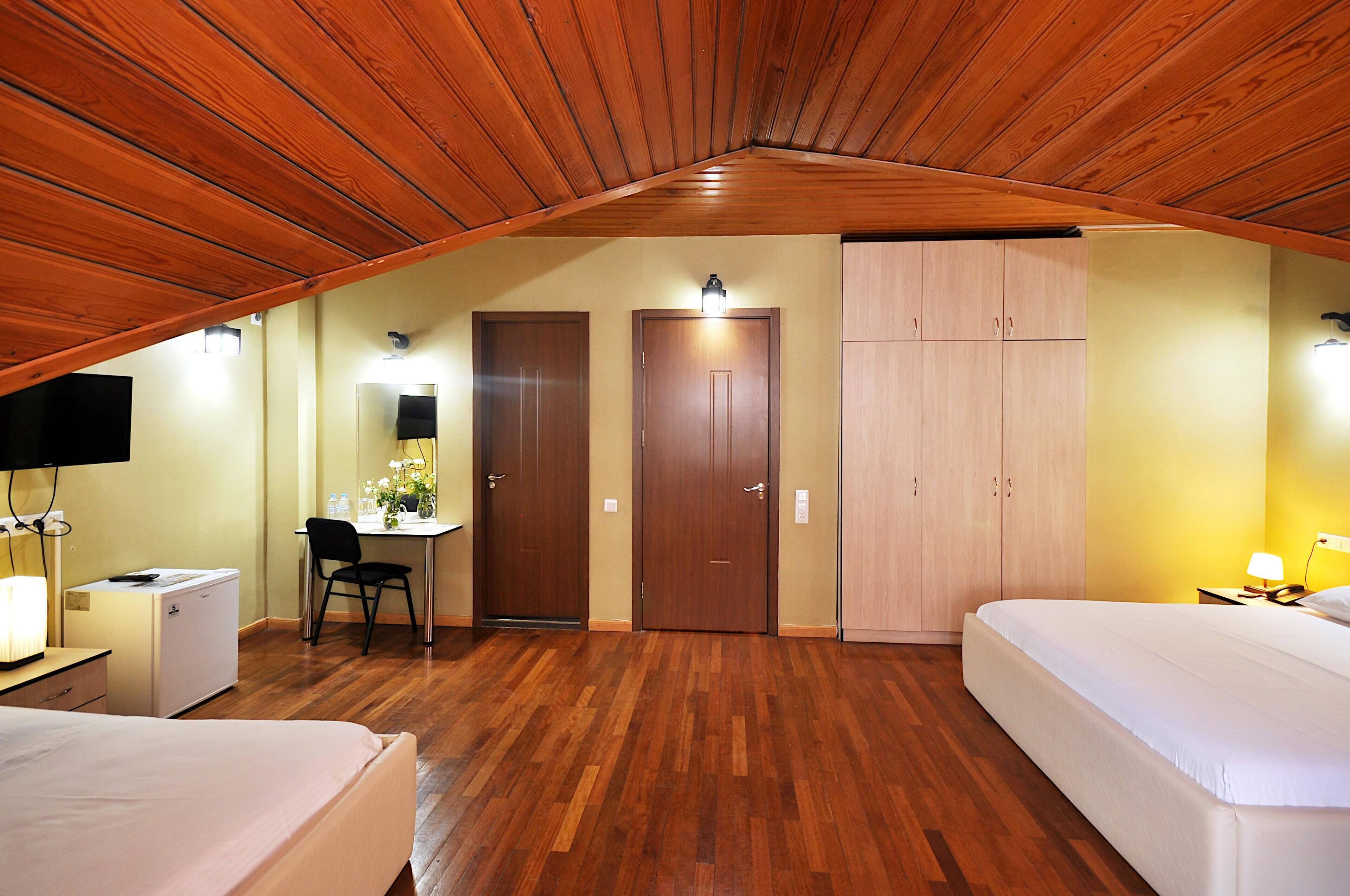 family triple room (attic) | 1 bedroom, minibar, desk, laptop workspace