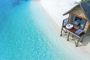 An overwater bungalow with a private pool, wooden deck, and direct beach access. - OZEN LIFE MAADHOO - Luxury All Inclusive with Free Transfers (Maadhoo)