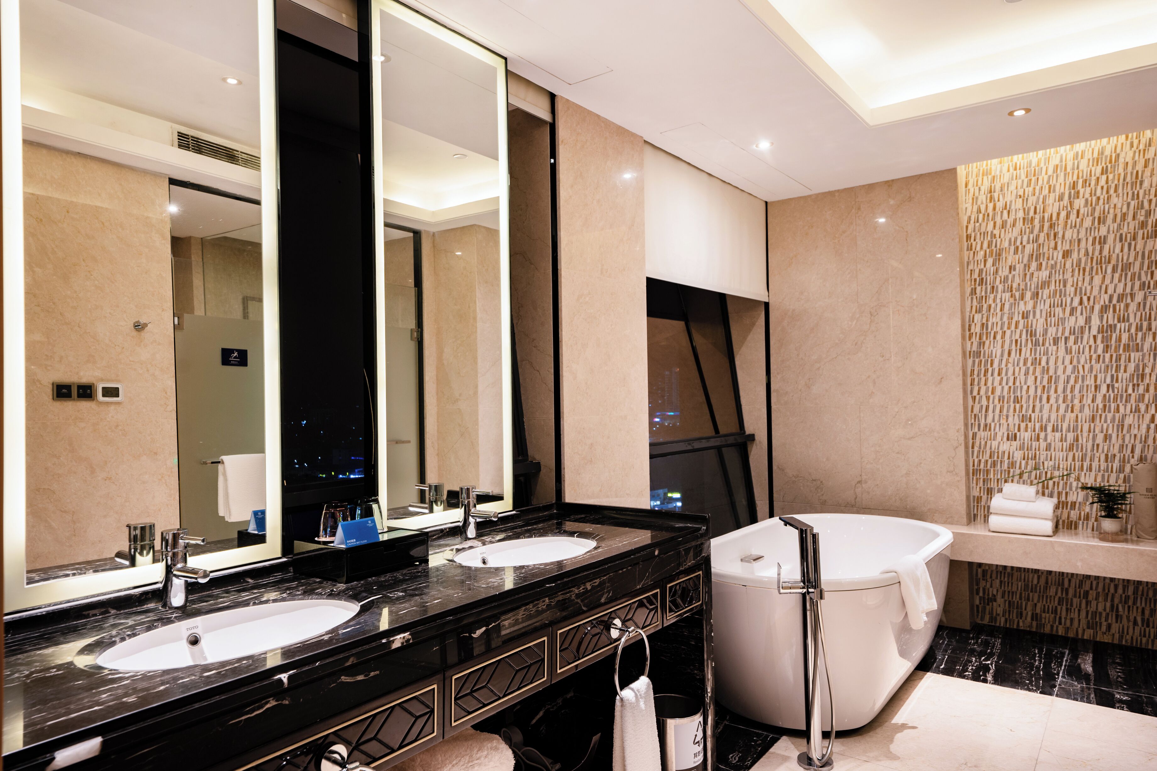 deluxe suite | bathroom | separate bathtub and shower, hair dryer, bathrobes, slippers